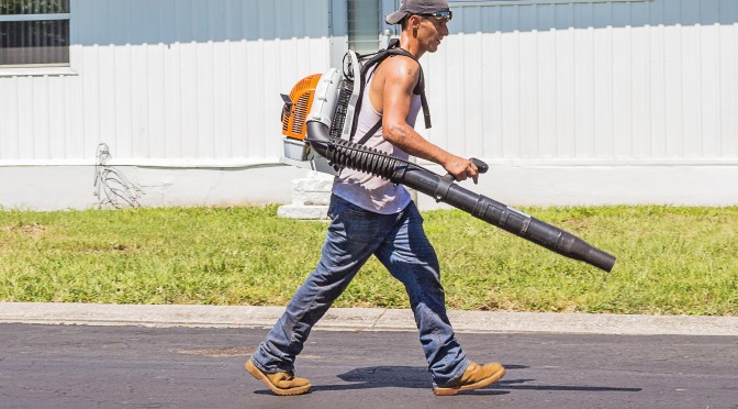 man-in-white-tank-top-and-blue-denim-pants-with-leaf-blower-162564